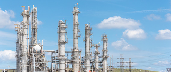 Oil refinery, oil factory, petrochemical plant in Pasadena, Texas, USA under cloud blue sky. Panorama style.