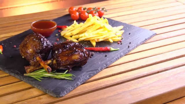 grilled bbq pork meat ribs on stone plate