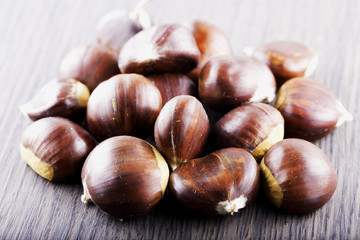 Chestnuts over wooden table