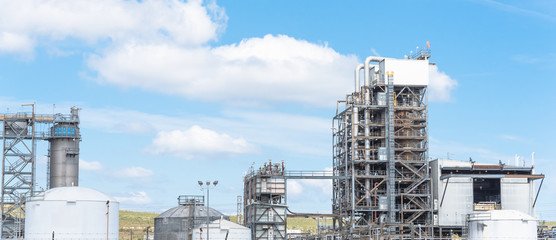 Oil refinery, oil factory, petrochemical plant in Pasadena, Texas, USA under cloud blue sky....