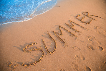 Summer sign on resort beach