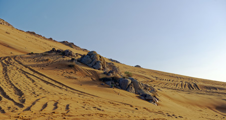 Desert safari vehicle terrain at sunset outside Dubai City, United Arab Emirates