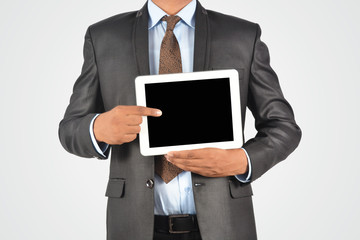 Businessman holding blank digital tablet pc, isolated very professionally