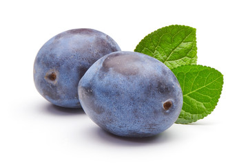 plums with leaves isolated on white background