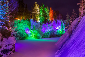 Illumination of a marble canyon. Ruskeala. Karelia Russia. Winter in Ruskeala. Marble canyon in winter.