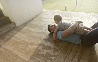 Caring father hugging his son