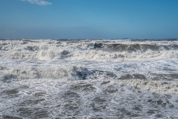 Stormy sea huge waves breaking near the coast