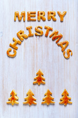 Inscription from the letters of cookies on the wooden table