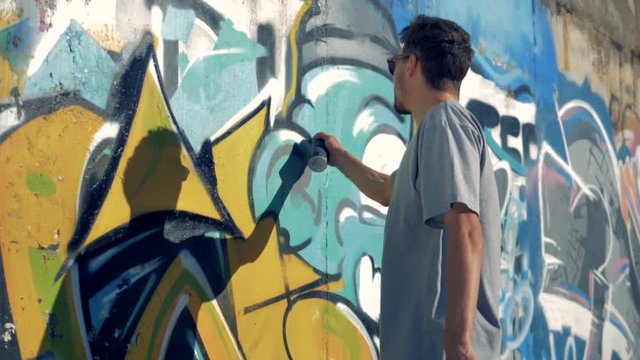 A graffitist freshens up the picture. 