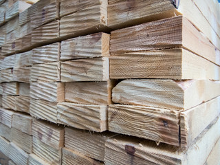 Wooden planks stacked together in a stack