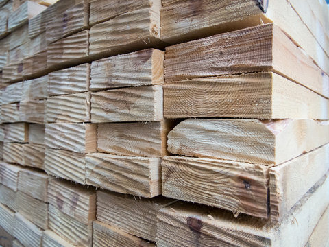 Wooden planks stacked together in a stack