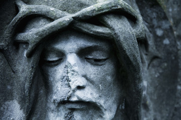 Partially destroyed ancient statue of suffering of Jesus Christ crown of thorns (religion, faith, death, resurrection, eternity concept)