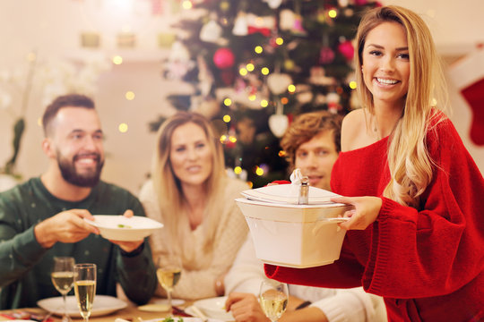 Group Of Family And Friends Celebrating Christmas Dinner