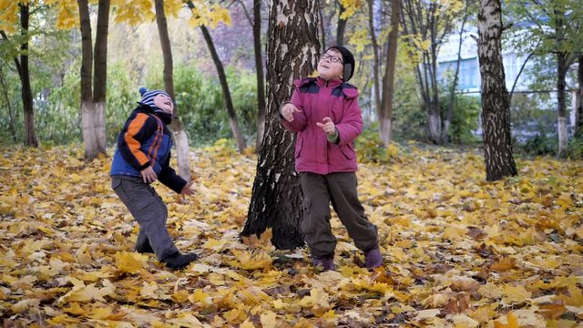 The time of year, Autumn. Children playing in the nature