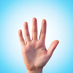 Man opened hand show five fingers on blue background