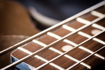 Fototapeta premium Used electric bass guitar closeup