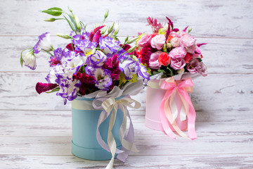 Blue and white lisianthus eustoma flower bouquet n a white wooden background
