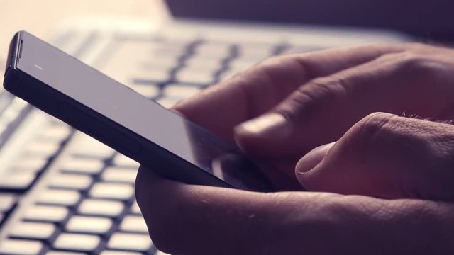 Sexting on mobile phone, man using smartphone app to send sexy texts and messages