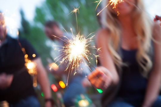 Cinco: Woman Holding Sparkler During Party