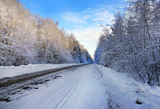 Winter road landscape, road in forest