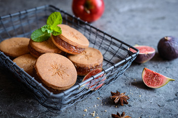Star anise shortbread sandwiches filled with grated apple and fig mixture