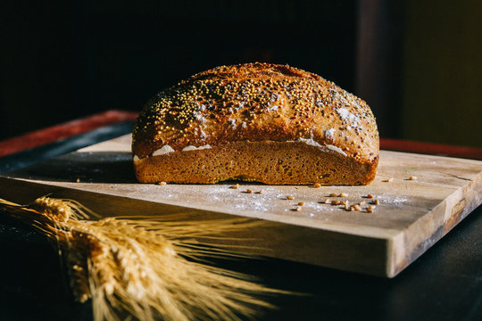 whole grain artisan loaf of bread from side view