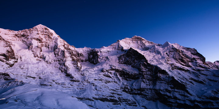 M??__nch and Jungfrau mountain peaks at dusk