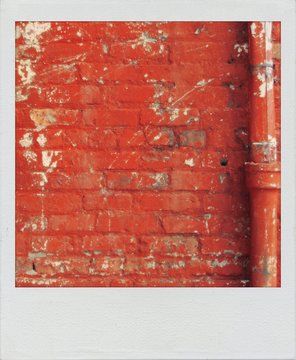 Fototapeta Old  snapshot print of an eroded red brick wall texture