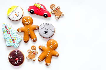Gingerbread cookies of different shapes on white background top view space for text