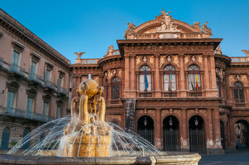 Landmarks of Catania: night view of the fountain of Dolphins in Piazza teatro Massimo, and a view of the Bellini theater - obrazy, fototapety, plakaty