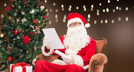man in costume of santa claus with letter
