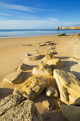 golden stones on the beach in Portugal
