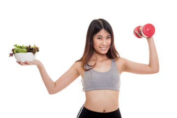 Beautiful Asian healthy girl with dumbbell and salad.