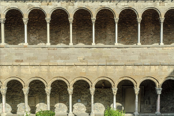 arches, columns and Romanesque capitals of the monastery of Santa Maria of Ripoll, in Catalonia, Spain.