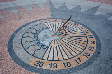 Sundial in the square at the day