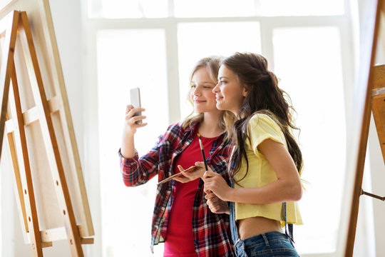 artist girls taking selfie at art studio or school