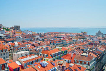 Fototapeta na wymiar Panoramic view of Lisbon city, Portugal orange bright roofs in a suuny day
