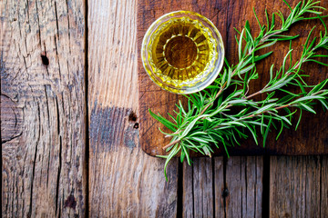 Cooking background concept Empty Chopping cutting Board for Meat,  Rosemary oil  on wooden  Background vintage  Copy space for Text