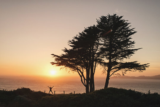 Silhouette of a man jumping for joy