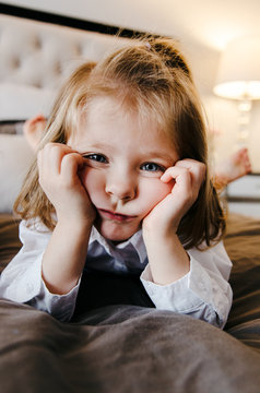 little girl making a sad, pouty face