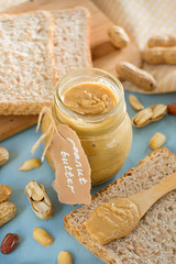 Fototapeta na wymiar Homemade peanut butter from roasted peanuts in jar