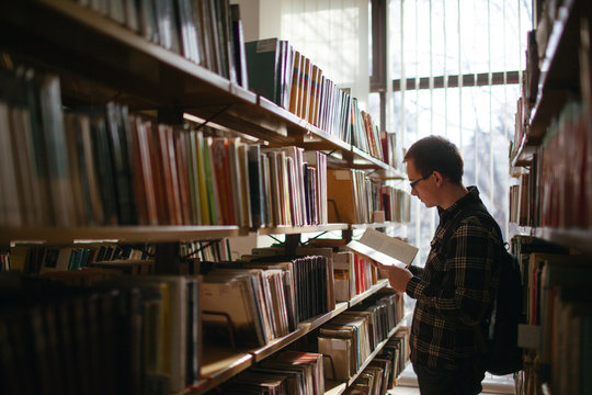 Young man reading a book