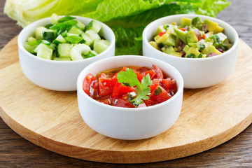 fresh sauces, guacamole, and salsa of tomatoes and cucumbers.