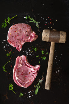 Seasoned raw pork steaks