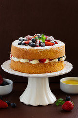 Genoise (cake) with cream, berries and lemon cream.