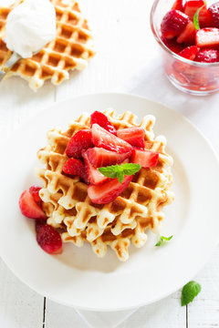 Homemade waffles with strawberry salad.