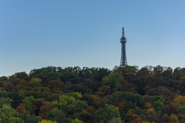 Obraz premium The Petrin tower is lighting during sunny day. Day view on Prague. 