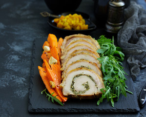 Fried pork loin stuffed with herbs and cheese.