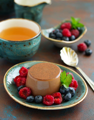 Delicious home-made chocolate dessert Panna cotta. Cream-caramel, caramel custard, with figs.