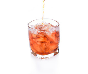Soft drinks in a glass on a white background.